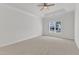Neutral bedroom with carpet, ceiling fan and a window at 4622 Ludwell Branch Ct, Raleigh, NC 27612