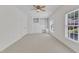 This bedroom features built-in shelving and lots of natural light at 4622 Ludwell Branch Ct, Raleigh, NC 27612