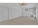 This bedroom features built in shelving and carpet flooring at 4622 Ludwell Branch Ct, Raleigh, NC 27612
