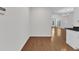Open-concept living space showcases hardwood floors and a view to the outdoor patio at 4622 Ludwell Branch Ct, Raleigh, NC 27612