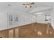 Open-concept living space with hardwood floors and easy access to other rooms at 4622 Ludwell Branch Ct, Raleigh, NC 27612