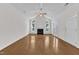 Open living area with hardwood floors, fireplace, and ample natural light at 4622 Ludwell Branch Ct, Raleigh, NC 27612