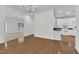 Inviting living area with hardwood floors, white trim, and a view into the modern kitchen at 4622 Ludwell Branch Ct, Raleigh, NC 27612