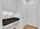 Mudroom features built-in storage, granite counters, and convenient access to the exterior at 4622 Ludwell Branch Ct, Raleigh, NC 27612