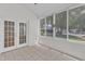 Sunroom features large windows, tile flooring, and access to the outdoor area at 4622 Ludwell Branch Ct, Raleigh, NC 27612