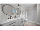 Elegant bathroom featuring dual sinks, sleek fixtures, and a modern shower at 505 Hawfields Rd, Mebane, NC 27302