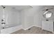 Bathroom featuring a tub with a white subway tile surround, vanity, and modern fixtures at 505 Hawfields Rd, Mebane, NC 27302
