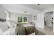 Cozy bedroom featuring a large window, natural light, and soft, comfortable bedding at 505 Hawfields Rd, Mebane, NC 27302