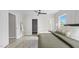 Bright bedroom featuring a ceiling fan, wooden floors, and a patterned rug at 505 Hawfields Rd, Mebane, NC 27302