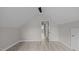 Cozy bedroom showcasing light wood floors and an open doorway leading to another room at 505 Hawfields Rd, Mebane, NC 27302