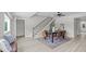 Open floor plan with a dining area featuring a staircase and stylish decor at 505 Hawfields Rd, Mebane, NC 27302