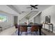 Open dining room with modern table, chairs, and view of the stairway at 505 Hawfields Rd, Mebane, NC 27302