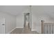 Bright hallway with hardwood floors leading to a room with a window with outside views at 505 Hawfields Rd, Mebane, NC 27302