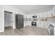 Contemporary kitchen with stainless steel appliances, white cabinetry, and plenty of counter space at 505 Hawfields Rd, Mebane, NC 27302