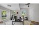 Bright living room with modern furnishings, large windows, and neutral color palette at 505 Hawfields Rd, Mebane, NC 27302