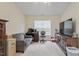 Spacious bedroom with neutral tones, ample natural light, and generous closet space, offering a relaxing retreat at 5104 Parkerwood Dr, Knightdale, NC 27545