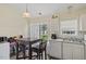Cozy dining area with sliding doors leading to a patio, perfect for enjoying meals and outdoor living at 5104 Parkerwood Dr, Knightdale, NC 27545