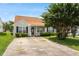 Charming home featuring manicured lawn, mature tree, and inviting front porch, perfect for relaxing outdoors at 5104 Parkerwood Dr, Knightdale, NC 27545