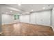 Large basement area with Herringbone floors, plenty of storage, and natural light at 5509 Cliffwood Ct, Raleigh, NC 27609