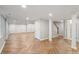 Expansive basement with herringbone floors, recessed lighting, and many storage options at 5509 Cliffwood Ct, Raleigh, NC 27609