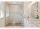 Bright bathroom with a glass shower, granite counters, single sink, and vanity creating a spa-like retreat at 5509 Cliffwood Ct, Raleigh, NC 27609