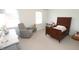 Charming bedroom features an antique bed, chair and carpet floor perfect for a young  at 5509 Cliffwood Ct, Raleigh, NC 27609