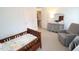Charming bedroom featuring neutral paint, wood floors, and a comfortable armchair at 5509 Cliffwood Ct, Raleigh, NC 27609