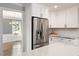 Gourmet kitchen with stainless appliances, custom cabinetry, and granite countertops at 5509 Cliffwood Ct, Raleigh, NC 27609