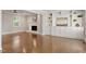 Bright and open living room with hardwood floors, fireplace, and built-in shelving, offering a welcoming atmosphere at 5509 Cliffwood Ct, Raleigh, NC 27609