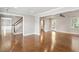 Expansive open-concept living area with hardwood floors, staircase, and views into other rooms, creating a seamless flow at 5509 Cliffwood Ct, Raleigh, NC 27609