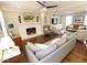 Cozy living room with hardwood floors, fireplace, a comfortable sofa, and built-in shelving, perfect for relaxation at 5509 Cliffwood Ct, Raleigh, NC 27609