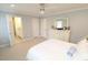 Bedroom featuring neutral carpet, ceiling fan, and an en suite bathroom, providing comfort and convenience at 5509 Cliffwood Ct, Raleigh, NC 27609