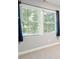 Two windows with window treatment and natural light at 5509 Cliffwood Ct, Raleigh, NC 27609