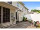 View of a private back patio with outdoor seating and a white fence at 5515 South Roxboro # 32, Durham, NC 27713