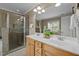 Bathroom features a double sink vanity, shower, and tiled floors at 5515 South Roxboro # 32, Durham, NC 27713