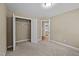 Bedroom featuring carpet floors, a closet, and an ensuite bathroom showcasing a clean and functional space at 5515 South Roxboro # 32, Durham, NC 27713