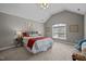 Vaulted bedroom with carpet flooring, ceiling fan, and large window at 5515 South Roxboro # 32, Durham, NC 27713