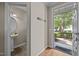 Inviting entryway with hardwood floors and view to powder room and manicured front yard at 5515 South Roxboro # 32, Durham, NC 27713