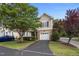 Charming townhome with a stone facade, attached garage and mature trees at 5515 South Roxboro # 32, Durham, NC 27713