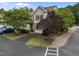 Charming townhouse exterior with stone accents, attached garage, and driveway at 5515 South Roxboro # 32, Durham, NC 27713