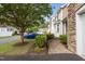 A sidewalk leads to the exterior of the home in a quiet neighborhood at 5515 South Roxboro # 32, Durham, NC 27713