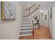Foyer with staircase, wood flooring, and elegant decor at 5515 South Roxboro # 32, Durham, NC 27713