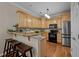 Kitchen with stainless steel appliances, granite countertops, and wood flooring at 5515 South Roxboro # 32, Durham, NC 27713