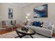 Comfortable seating in this spacious living room with decorative artwork at 5515 South Roxboro # 32, Durham, NC 27713