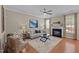 Cozy living room with fireplace, hardwood floors, and lots of natural light at 5515 South Roxboro # 32, Durham, NC 27713