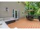 A spacious outdoor deck with a seating arrangement, outdoor couch, and easy home access at 5900 Holly Dr, Raleigh, NC 27616