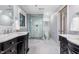 Stylish bathroom features dual vanities, glass enclosed shower and elegant design elements at 5900 Holly Dr, Raleigh, NC 27616
