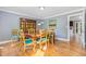 Elegant dining room with hardwood floors, classic furniture, and stylish decor at 5900 Holly Dr, Raleigh, NC 27616