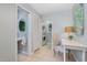 Functional hallway leading to a half bath and laundry closet, complete with a desk space at 5900 Holly Dr, Raleigh, NC 27616