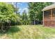 Secluded backyard with mature trees, professional landscaping, and plenty of space for entertainment at 6 Tulip Tree Ct, Durham, NC 27712